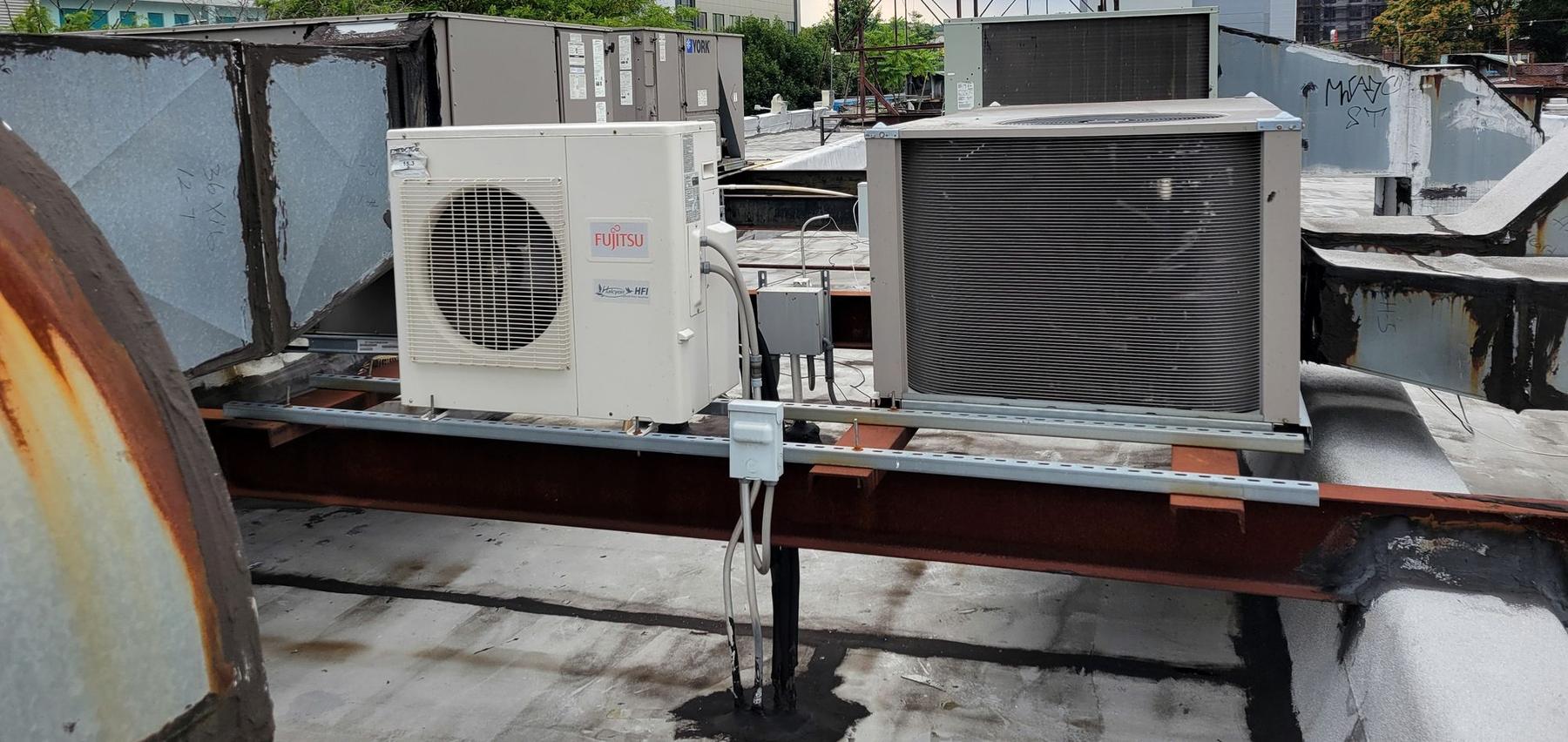 Condenser units set on steel dunnage on a Brooklyn rooftop